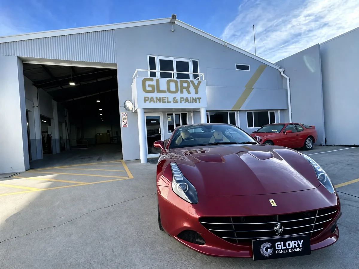 Red Ferrari California outside GLORY Panel & Paint, Hornby